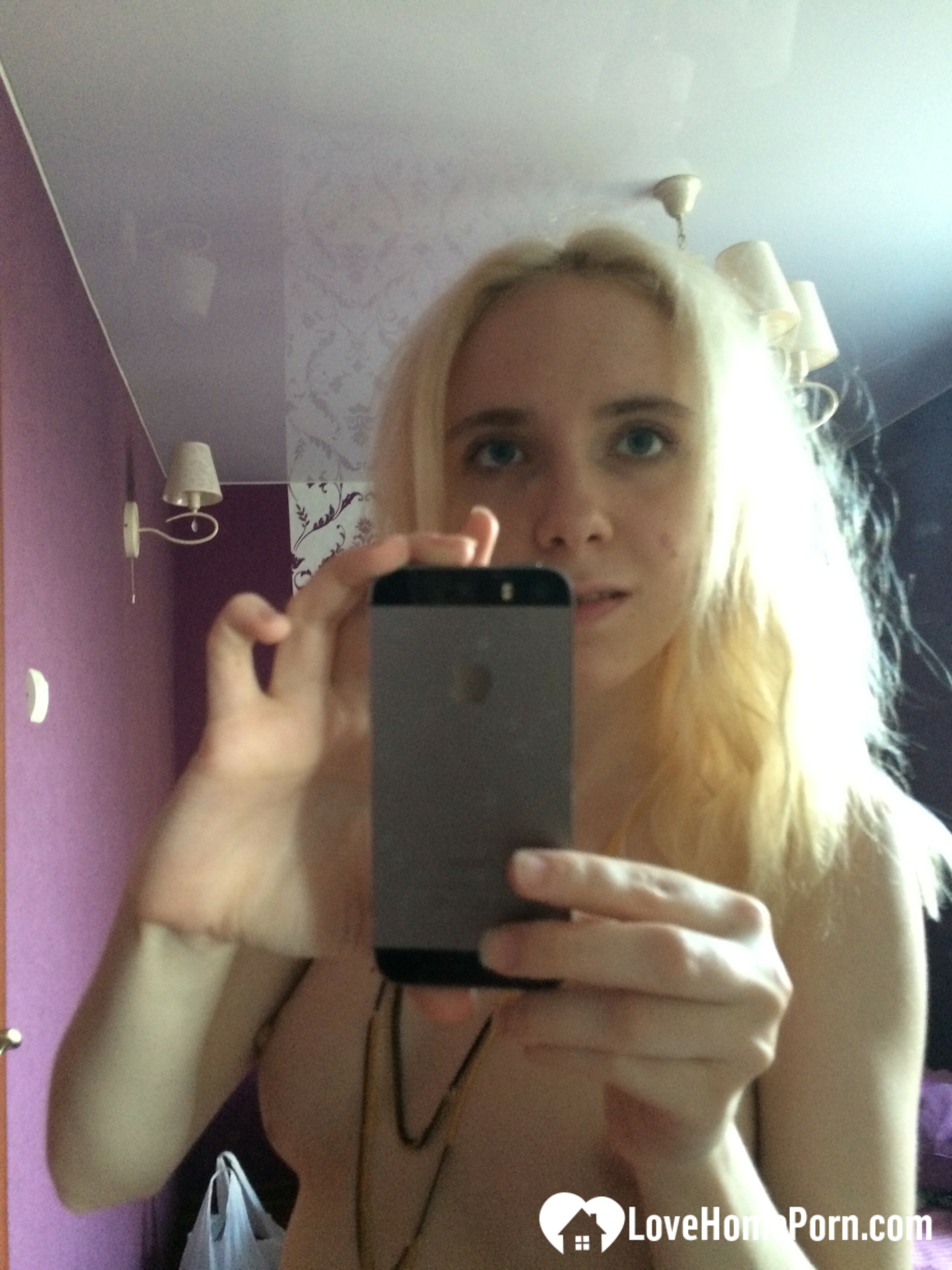 Skinny blonde cutie taking a couple of selfies — 12